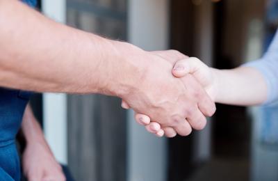 Closeup of man and woman shaking hands